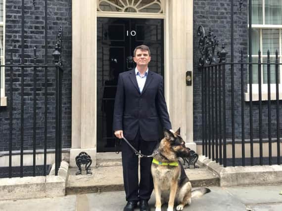 Robin Christopherson and his dog Archie outside 10 Downing Street. Photo supplied.