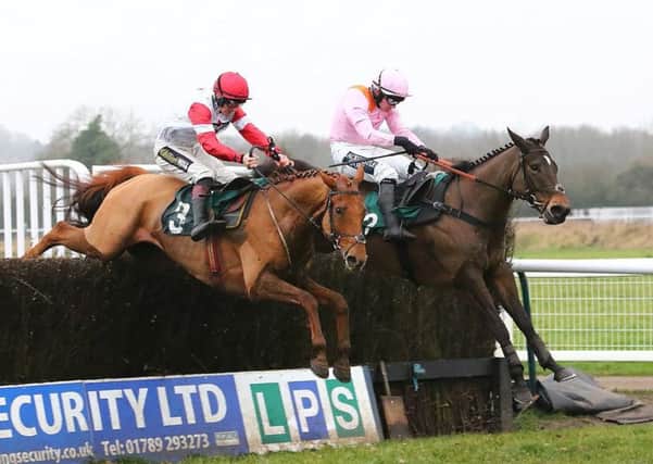 Manofthemoment, right, jumps the final fence alongside Summit Like Herbie in the LPS Handicap Chase. Picture: www.dwprattracingphotography.co.uk