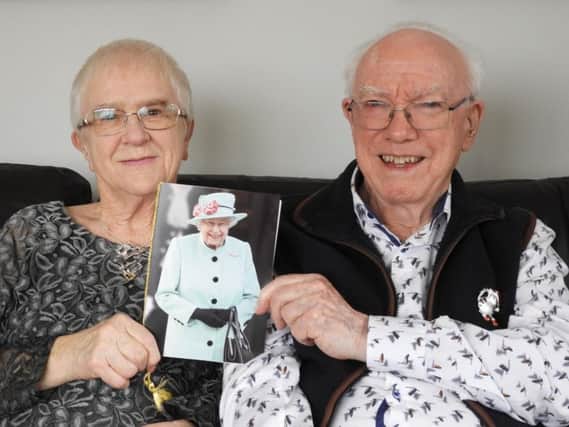 Chris and Daphne Thomas with their card from the Queen
