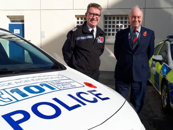 Chief Constable Martin Jelley and Warwickshire Police and Crime Commissioner Philip Seccombe commemorating the launch of the Poppy Appeal logos on force police cars.