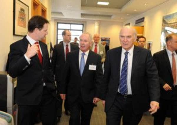 Deputy Prime Minister Nick Clegg and Business Secretary Vince Cable with Sir Peter Rigby of the Coventry and Warwickshire LEP at the Heritage Motor Centre in Gaydon.