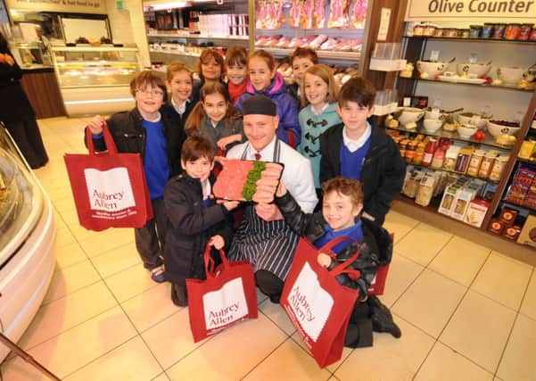 Children from St Peter's Primary Schoo lwere invited to Aubrey Allen as part of celebrations for National Butchers' Week to see how the business makes its burgers and sausages.
The children are pictured woth Master Butcher Nick Clayton-Gale.
MHLC-06-07-13 Burgers Mar19