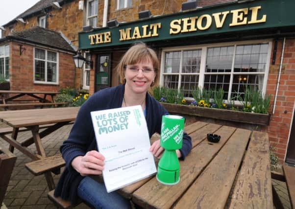 The Malt Shovel pub at Gaydon has raised £365 for Macmillan Cancer Support by taking part in a nationwide charity quiz and holding a raffle.
Owner Debi Morisot shows off her Macmillan certificate.
MHLC-06-03-13 Pub fundraising Mar26