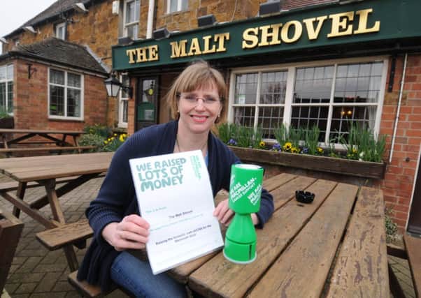 The Malt Shovel pub at Gaydon has raised £365 for Macmillan Cancer Support by taking part in a nationwide charity quiz and holding a raffle.
Owner Debi Morisot shows off  her Macmillan certificate.
MHLC-06-03-13 Pub fundraising Mar26