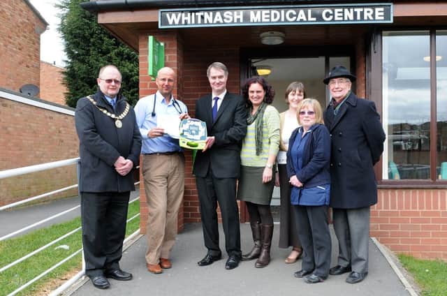 MHLC-12-03-13 Defib Whitnash Mar51
Coppice Road,Doctor's Surgery, Whitnash as a new  Public Access Defibrillator (PAD is being unveiled at the surgery.  From the left,Cllr Adrian Barton Mayor of Whitnash,Dr Tesan Hadzikadunic, Adrian Lewis (founder),Dr Jenny Martin, Dr Kate Holtby , Nurse Kate Nash and County Councillor Bernard Kirton .