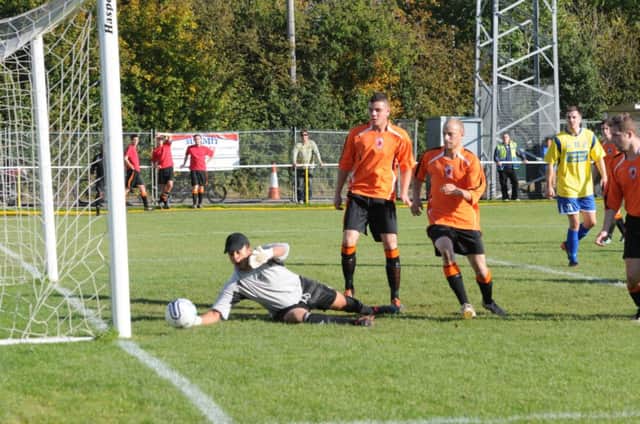 Bromsgrove keeper Reece Francis, seen here in the reverse fixture, produced a fine save to deny Southam Uniteds Pawel Tomczak during his sides 2-1 victory.