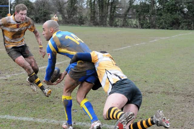 Nyle Beckett, who had an oustanding afternoon for Kenilworth, looks to offload after being collared by a Droitwich tackler.