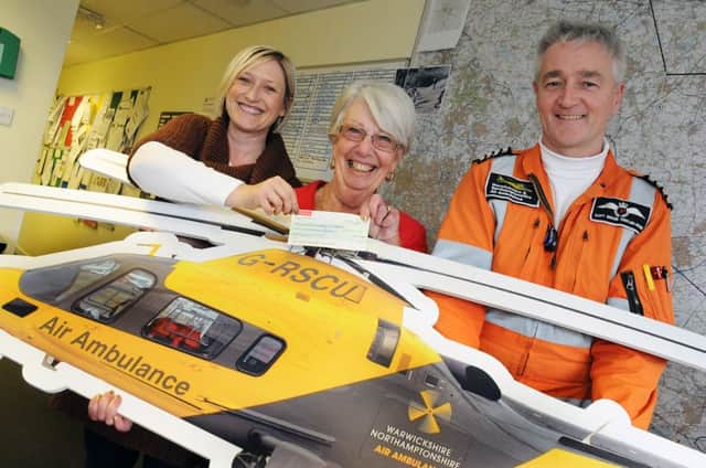 MHLC-20-03-13 Cooper donation Mar25 
Pictured,Teresa Cooper  (middle ) presented a donation of £2.320 to the air ambulance. to Sarah Wakeman (fundraising manager) and Captain Shaun Tinkler-Rose, She raised the money by doing a solo 120-mile walk across Lanzarote. Teresa has had to learn how to walk and talk again after suffering a stroke and still has problems with speech .
