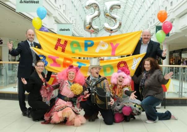 MHLC-27-03-13  Priors Anniversary Mar93
Royal Priors shopping centre is celebrating its 25th Anniversary. 
Pictured,from the left,at back,Les Watkins (deputy centre manager),
 Gerry McManus ( centre manager) ,fron row,Sarah Jones (operations manager),Mrs Whistle,Lemmy,and Sparkle (charachter names), and Kelly Iles,who made the 25th Anniversary cake from spangles shop.