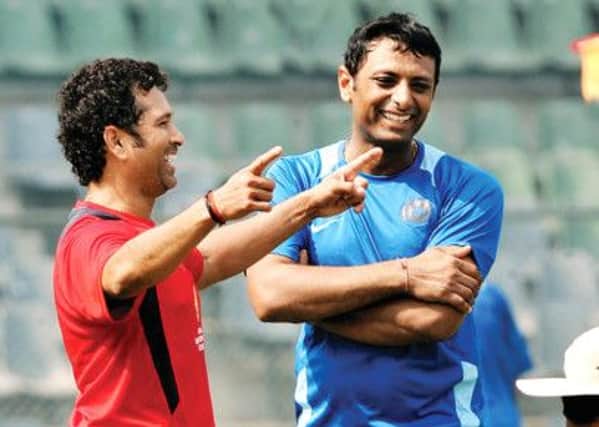 Sachin Tendulkar and Sitanshu Kotak share a joke ahead of the  Ranji Trophy final.