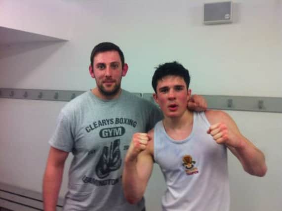 Clearys ABC boxer Myles Vale with trainer Jamie Bannister.