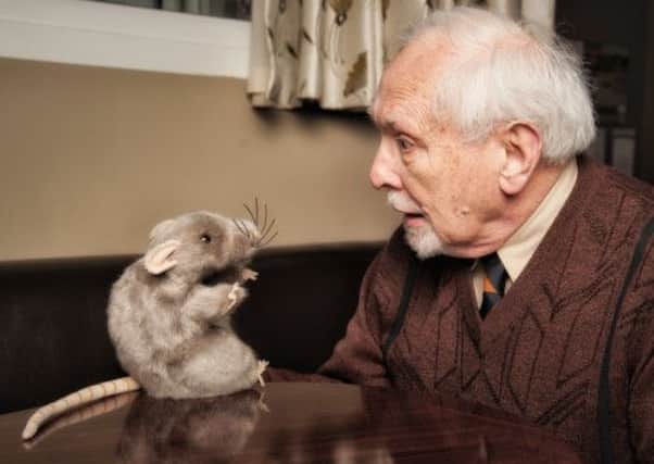 Major (Neville Malin) and Basil the Rat meet face to face in the Talisman Theatre's production of Fawlty Towers.