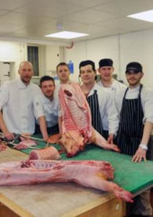 MHLC-17-04-13 Pig chefs Apr47
Chefs at the Star and Garter pub in Leamington are spending the afternoon at Aubrey Allen,Warwick street,shop to learn about how to butcher a pig and what to do with the different cuts to prepare for a pig-themed menu over the next few days. The idea is to inspire people to think more about where their food comes from and to not waste parts of an animal that they might not normally think to eat.
Pictured, Martin Crombie (head butcher) demonstrating to Tom Lilley (head chef), James Neal,Leon Higham,James Dawes and Dominic Henry.