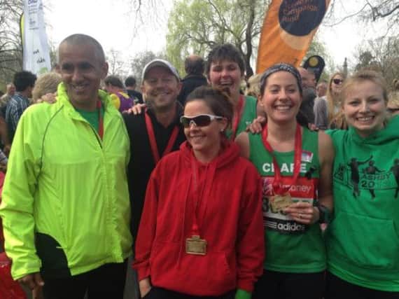 Six of Spa Striders London Marathon finishers enjoy the moment: Simon Radcliffe, Nick Adams, Melissa Venables, Roz Cox, Clare Hinton and Barbara Gunter.