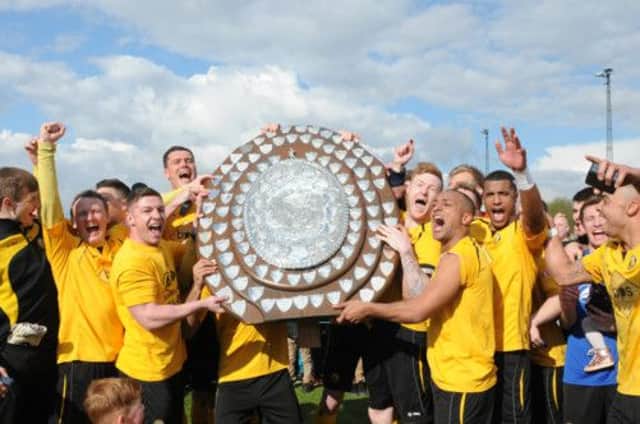 Leamington players celebrate with the imposing Southern League Premier Division shield. MHLC-27-04-13 Brakes Apr92