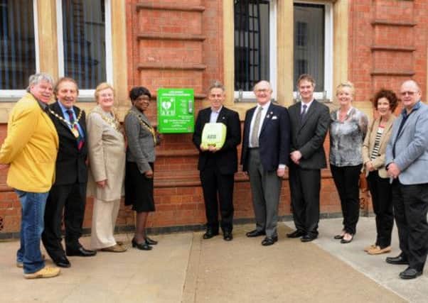 MHLC-25-04-13 Defib Apr85 
The unveiling of a defibrillator,out side Leamington town hall, funded by Leamington Round Table.
Pictured, Cllr Yvonne Moore (Mayor of Royal Leamington Spa), Cllr Michael Kinson OBE (Chairman of the Council ), Cllr Elizabeth Higgins 9mayor of Warwick, Nicholas Herd,Cllr Roger Copping,Adrian Lewis (founder), and various dignitaries.