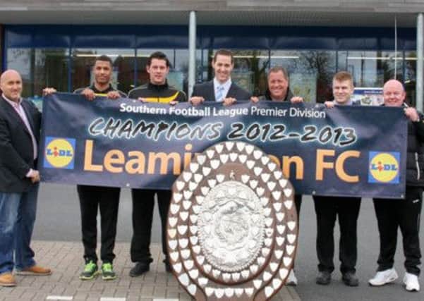 Nic Sproul of Leamington FC, players Joe Magunda, Michael Tuohy, Nicholas Culverwell (Lidl), Mark Davidson (store manager) and Leamington manager Paul Holleran.