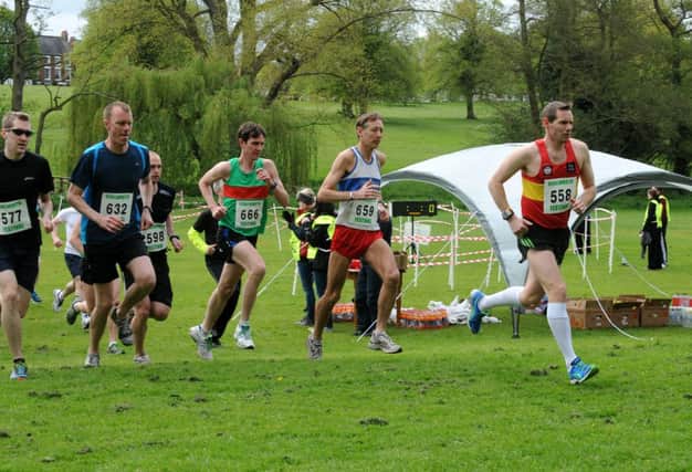 Emerson Combstock hits the front straight from the off in the Kenilworth Festival 10k, with Bryan Miller and Daniel Stannard in close attendance. MHLC-11-05-13 Kenilworth Hilly May34