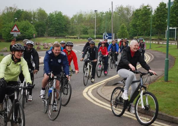 Linda Pemberton cycling with her supporters last year.