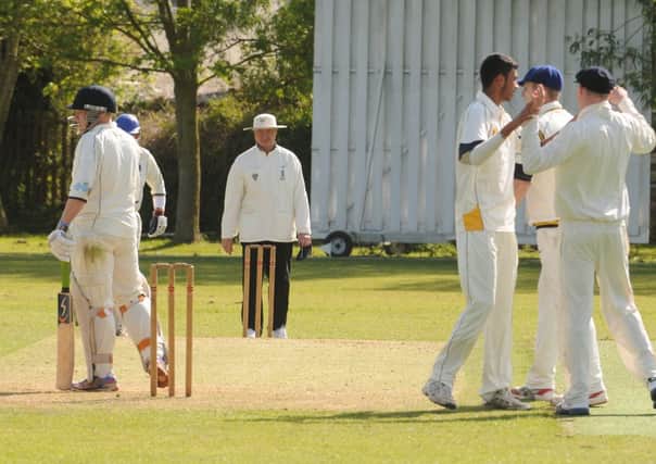 Warwick opening bowler Rajan Bhatti  is congratulated after claiming the wicket of Studleys Chris Moss. MHLC-25-05-13 Warwick CC May53