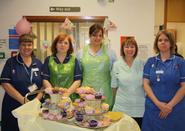 Nurses on the Squire ward at Warwick Hospital prepare for a fundraising tea party for Dementia Research.