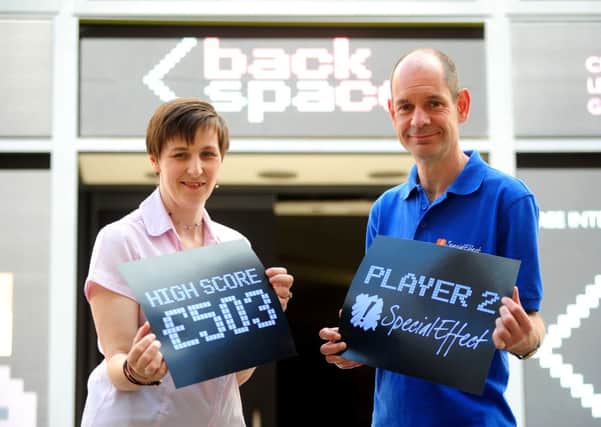 The team who organised the Backspace exhibition as part of the Leamington Looks Back history festival have raised £1,000 to donate to SpecialEffect, a charity which funds computer games adapted for disabled people, and to Myton Hospice.
Pictured: Natalie Griffith (Event Director) & Mark Saville (Communications Officer - SpecialEffect).