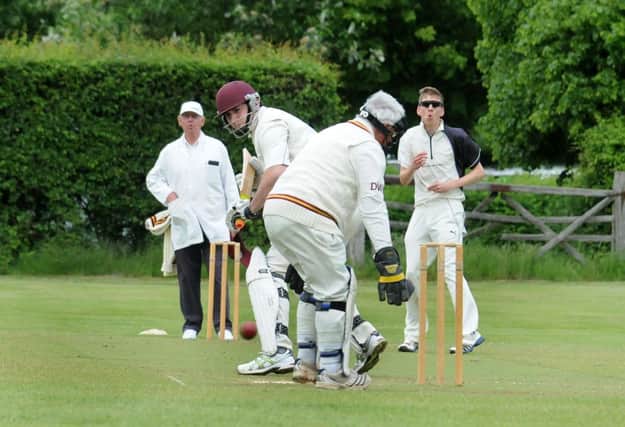 Stoneleigh spinner Phil Chapman shows his anguish as a delivery to Ben Ashmore slips away down the legside. MHLC-15-06-13 Stoneleigh CC Jun65