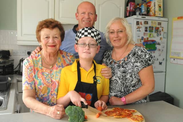 MHLC-19-06-13 Kitchen comp Jun7
The couple were entered into the Courier £10,000 kitchen competition by mum-in-law and won.
Pictured, from left,(Rees family) June,David, Alison and Jordan (centre) has a very rare brain condition, has a learning disability and very poor sight but loves to cook.