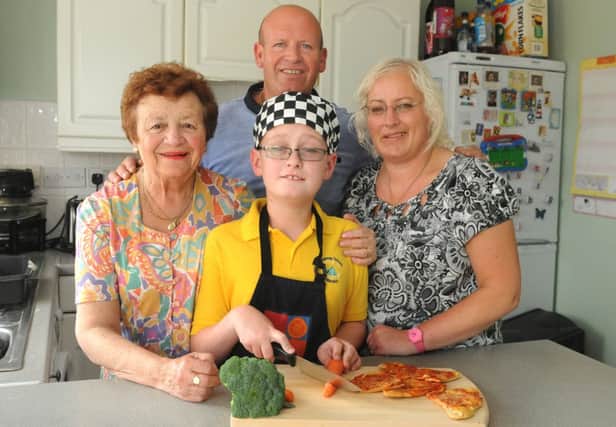 MHLC-19-06-13 Kitchen comp Jun7
The couple were entered into the Courier £10,000 kitchen competition by mum-in-law and won.

Pictured, from left,(Rees family) June,David, Alison and Jordan (centre) has a very rare brain condition, has a learning disability and very poor sight but loves to cook.