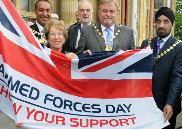 MHLC-24-06-13 Flag raising Jun90 
Flag raising ceremony for Armed Forces Day. at Leamington Town Hall.
Pictured,Cllr Bob Dhillon, Mayor of Warwick, Cllr John Knight,Leamington Deputy Mayor,Cllr Felicity Bunker,Kenilworth Town Mayor,
Cllr Richard Davies, Warwick District Council chairman,Warwick District Council chairman Richard Davies raising the flag at 10am.and Cllr Parminder Birdi,whitnash Town Mayor.


Pictured,