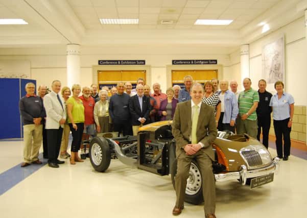 Stephen Laing, curator at the Heritage Motor Centre and volunteers with the restored 1958 MGA Twin Cam Coupe chassis.
