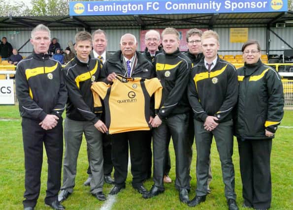 In happier times: former Leamington youth team manager Darren Bradley, far left, at the presentation of their new shirt, with Jim Scott, fourth from the right, and  Bradleys assistant Henry Jordan, far right.