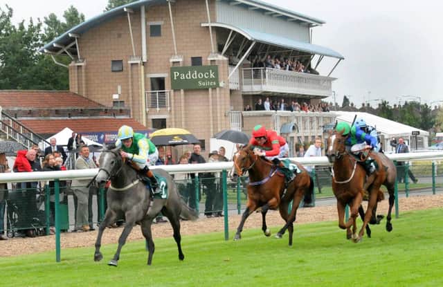 Winning Express, far left, takes the QIPCO 1,000 Guineas underJames Doyle. MHLC 28-06-13 Warwick Races Jul24