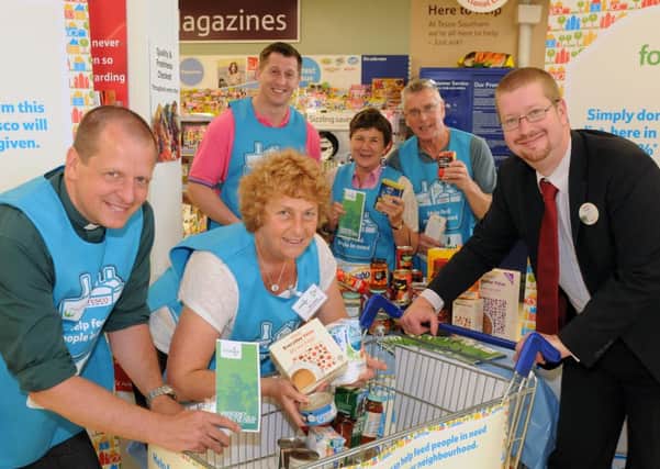 MHLC-05-07-13 Fosse food bank Jul34 
Tesco,Southam ,first collection day for the new Fosse Foodbank. Volunteers are taking collections fortwo days .
Pictured,Rev Barry Jackson,Ros Grant (food bank manager),Stuart Lavens (store manager), VolunteersIan Faulkner,Sue Foden and Mervyn Fell.