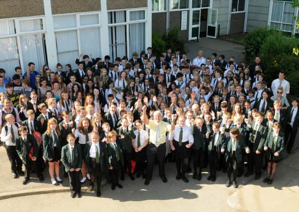 MHLC-10-07-13 Robert Burley Jul151
 Robert Burley,Physics teacher is retiring after 39 years.
 Pictured, with all the pupils (250) in the Webb Ellis House.
