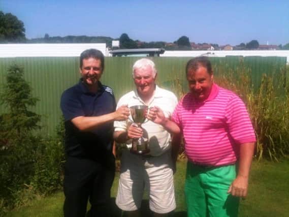 Rob Mason (left) and Tim Burden (right) being presented with the Roly Scandrett Cup by Roly Scandrett (middle), who is also the current Warwick Golf Club Captain