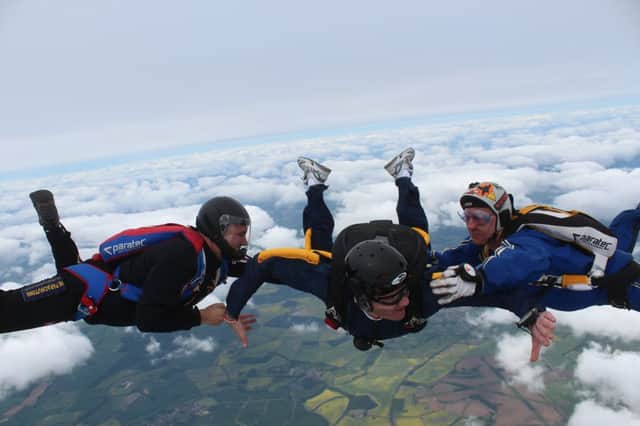 Rob Cameron - just after leaping out of a plane for charity.