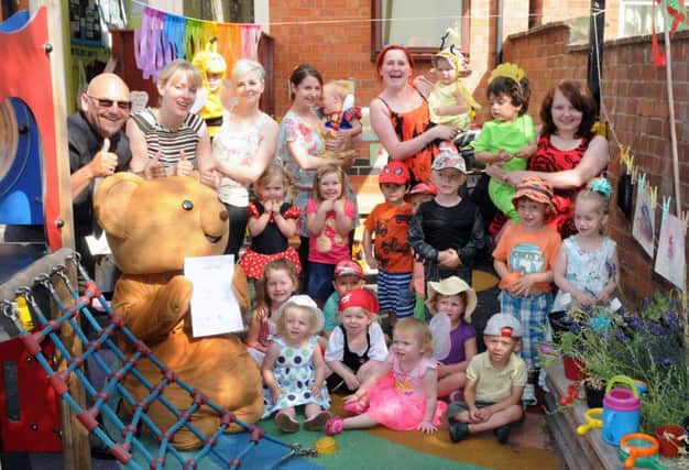 MHLC-17-07-13 Funflower Jul153
Little Angels nursery,took Funflower walk by youngsters and staff  for Myton Hospice.
Pictured,Nigel Adams from Myton Hospice, Myton Monty Bear,Angelena Gramtham (owner) and Staff with children .