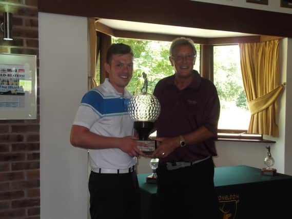 Nett winner and vice-captain Ken Wykes, right, presents Stoneleigh Deer Parks club champion gross trophy to Luke Brown.