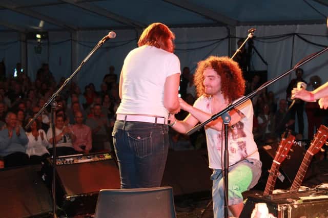 Scott Taverner proposes to his girlfriend Caroline Sampson at the Warwick Folk Festival 2013.