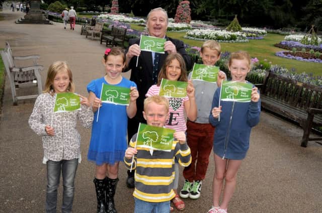 Local children help Chairman of Warwickshire County Council Dave Shilton to celebrate Jephson Gardens and Mill Gardens being awarded Green Flag status.
MHLC 30-07-13 Green Flag Jul198