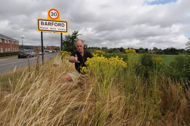 Robin Smith-Ryland is a landowner in Barford who says the district council has failed to eradicate ragwort, a poisonous plant which is harmful to his cattle and horses. He has been complaining about it for some time but no action has been taken.
MHLC-02-08-13 Ragwort planting Jul201