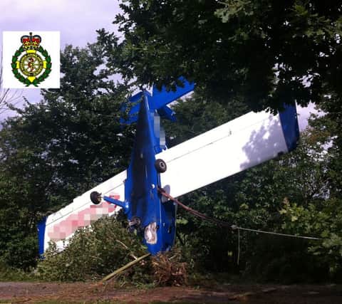 The light aircraft which overturned after an unscheduled landing at a field in Loxley. Photographe courtesy of West Midlands Ambulance Service.