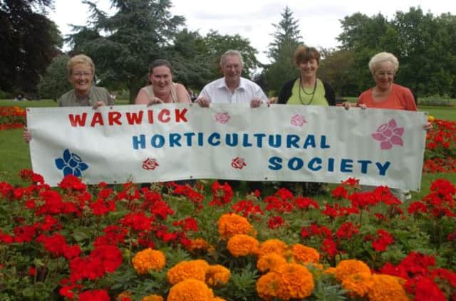 Hortic_LC_Aug 42
pre-piece for the Warwick Horticultural Society's annual show. Members fromthe left - Joy Coop - Chairman, Sam Jones - Treasure , Dave Clough , Elizabeth  Burridge , Sylvia Murray - Trading officer .