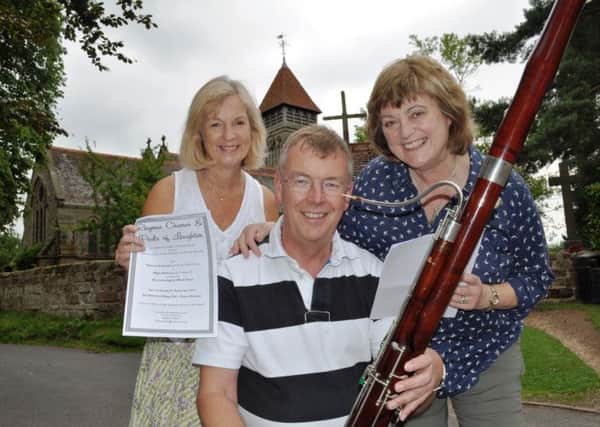 Patricia Gallimore - Pat Archer from The Archers - (right) and BBC radio programme maker Jane Marshall join bassoonist Chris Vincett outside St James Parish church in Old Milverton.