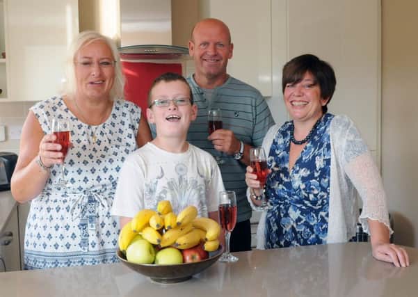 MHLC-06-09-13 Kitchen joy SEPT 22

Courier/Modern Homes £10k kitchen competition winners.

Alison and David  Rees and son Jordan. Tina Riley, owner of Modern Homes. in there new kitchen .