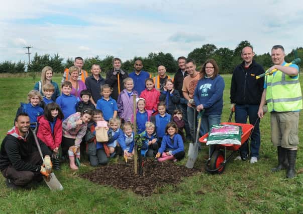MHLC 10-09-13 Orchard Sep36

DHL staff from Rugby, working with Long Itchington community and Long Itchington C of E Primary School staff on to transform field into an Orchard with picnic area and a Wildflower meadow.The field (Marton Road).