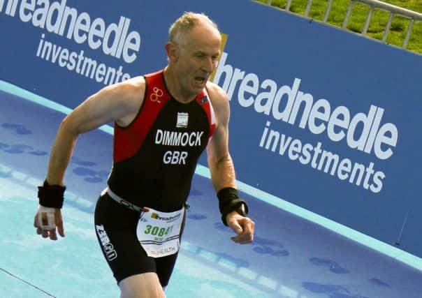 Nigel Dimmock approaches the finish line in London.