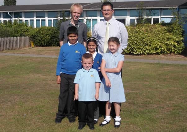 Cllr Jonathon Chilvers (left) and  headteacher Martin Ledgard with pupils at Kingsway Community Primary School.