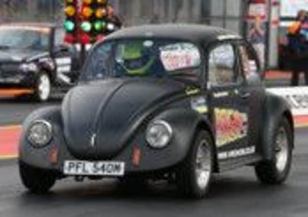 Jason Anslow in his 1974 Volkswagen Beetle. Picture submitted